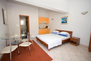 Posteľ alebo postele v izbe v ubytovaní Ella Apartments