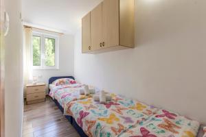 Postel nebo postele na pokoji v ubytování Apartmani Marinela