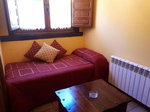 Ein Bett oder Betten in einem Zimmer der Unterkunft Posada La Vieja Escuela
