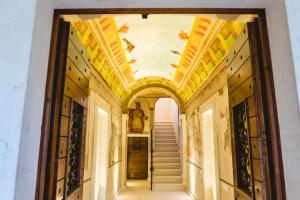 a hallway with a staircase in a building at Villa Colli Storici in Desenzano del Garda