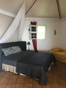 Postel nebo postele na pokoji v ubytování Morne Charlotte