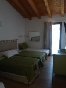 Voodi või voodid majutusasutuse Agriturismo "La di Buiat toas