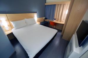 Postel nebo postele na pokoji v ubytování ibis Arapiraca