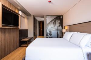 Postel nebo postele na pokoji v ubytování Hotel Habitel Prime