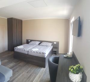 Postel nebo postele na pokoji v ubytování Holiday Centrum