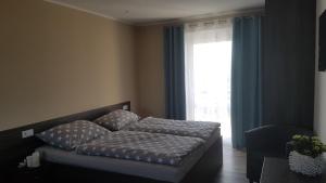 Postel nebo postele na pokoji v ubytování Holiday Centrum