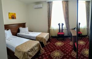 Postel nebo postele na pokoji v ubytování Georgia Hotel