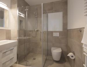 ノルダーナイにあるMeerBlickD21 Residenzenのバスルーム(シャワー、トイレ、シンク付)