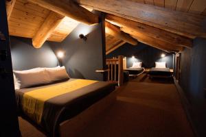 a bedroom with a bed in a room with wooden ceilings at The Suttle Lodge & Boathouse in Camp Sherman