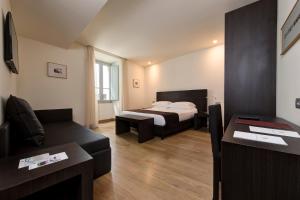 Postel nebo postele na pokoji v ubytování Hotel Tiferno + 29 fotografií