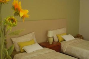 En eller flere senge i et værelse på Quinta do Quarteiro