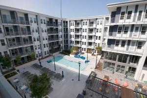 an apartment complex with a swimming pool in the middle at BCA Furnished Apartments in Atlanta