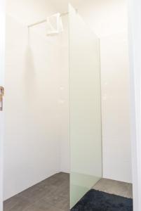 
a bathroom with a white shower curtain at Arcadas Cozy Apartments - AU in Funchal
