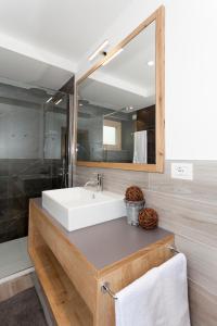 a bathroom with a white sink and a mirror at Junior Suite Orso Grigio in Andalo