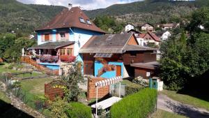 a large house with a brown roof at Meublé de tourisme in Oderen