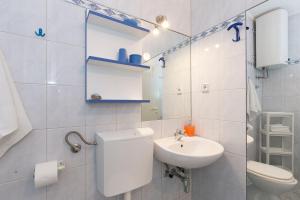 Kúpeľňa v ubytovaní Apartments Krajina