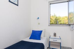 Posteľ alebo postele v izbe v ubytovaní Apartments Krajina