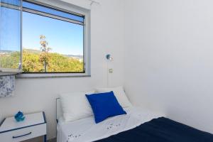 Posteľ alebo postele v izbe v ubytovaní Apartments Krajina