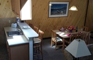 a kitchen and dining room with a table and a sink at Club Tahoe Resort in Incline Village