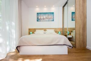 Posteľ alebo postele v izbe v ubytovaní Lugo Apartments