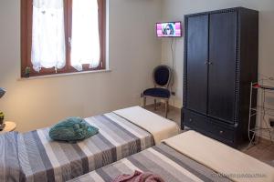 Postel nebo postele na pokoji v ubytování La casa di Primo