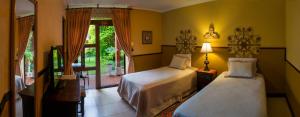 מיטה או מיטות בחדר ב-Hostal Villa Toscana
