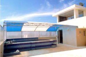 a view of a building with a blue and white at Maluva in Salinas