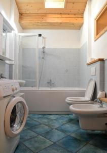 
a bathroom with a toilet a sink and a bathtub at Premesan3 in Bormio
