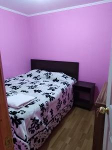 Postel nebo postele na pokoji v ubytování Jallalla + 1 fotografie
