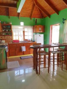 A kitchen or kitchenette at Seawind Cottage Authentic St.Lucian Accommodation near Plantation Beach