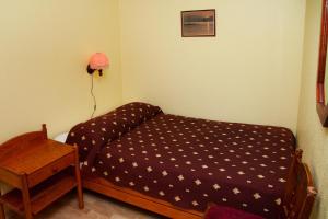 Postelja oz. postelje v sobi nastanitve Repo Hotel