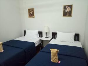 Rúm í herbergi á TT Hostel Chiangrai