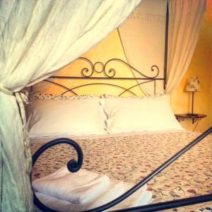 Postel nebo postele na pokoji v ubytování B&B MilleQuattrocento