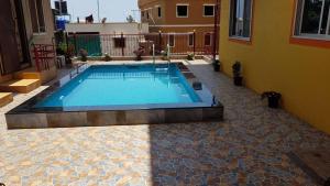 a swimming pool in the courtyard of a house at Silver Oak Villa in Panchgani