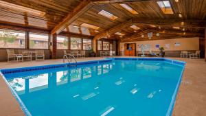 a large swimming pool in a building with a ceiling at Best Western Canyon De Chelly Inn in Chinle