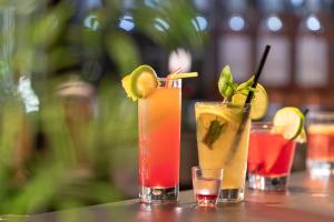 a group of three cocktails sitting on a table at Best Western Plus H&ocirc;tel La Joliette in Marseille