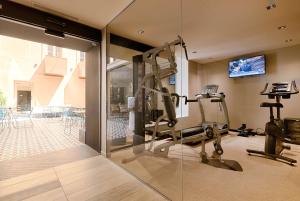 a room with a gym with a tread machine at Best Western Plus Hôtel La Joliette in Marseille