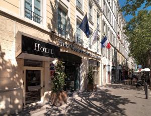 a building with a sign for a hotel on a street at Best Western Plus Hôtel La Joliette in Marseille