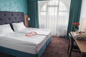 Postelja oz. postelje v sobi nastanitve Hotel Galatea