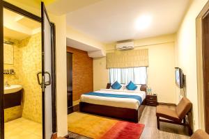 Ένα ή περισσότερα κρεβάτια σε δωμάτιο στο Gaju Suite Hotel