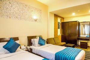 Ένα ή περισσότερα κρεβάτια σε δωμάτιο στο Gaju Suite Hotel