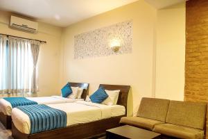 Ένα ή περισσότερα κρεβάτια σε δωμάτιο στο Gaju Suite Hotel