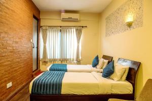Ένα ή περισσότερα κρεβάτια σε δωμάτιο στο Gaju Suite Hotel