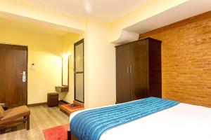 Ένα ή περισσότερα κρεβάτια σε δωμάτιο στο Gaju Suite Hotel