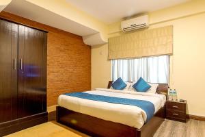 Ένα ή περισσότερα κρεβάτια σε δωμάτιο στο Gaju Suite Hotel