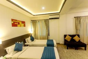 Ένα ή περισσότερα κρεβάτια σε δωμάτιο στο Gaju Suite Hotel