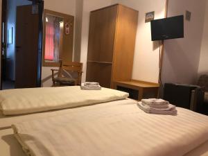 Postel nebo postele na pokoji v ubytování Krügers Hotel