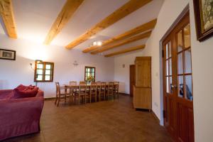 a living room with a couch and a table at Holiday Villa Stupna in Vidochov