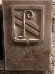a metal sign for the hotel receptionetheus ball at Abbaye de Maizières in Beaune