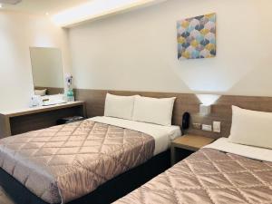 Postel nebo postele na pokoji v ubytování Chance Hotel